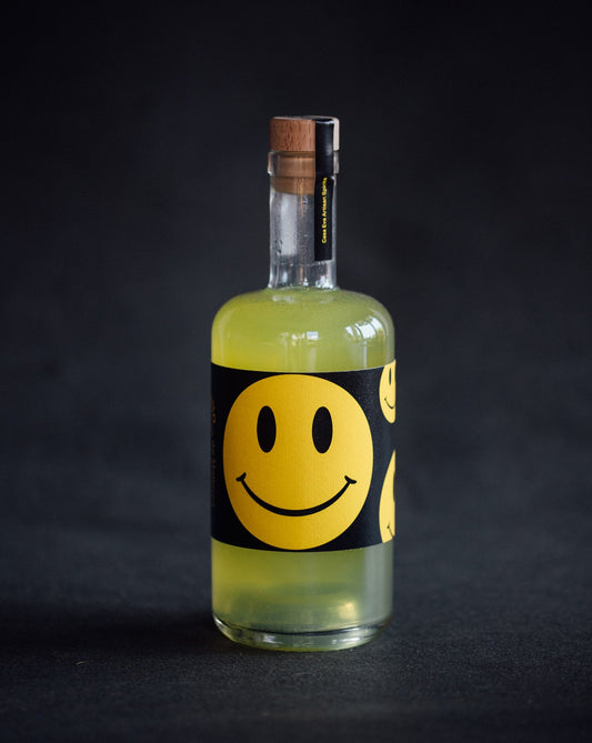 botella de Limoncello con un smily